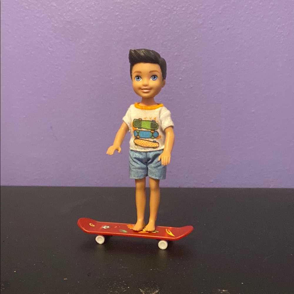 Skateboarder Doll with Red Skateboard
